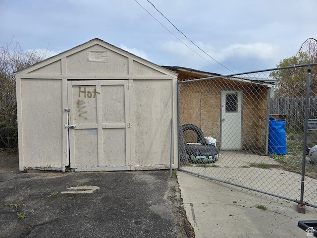 view of shed featuring fence