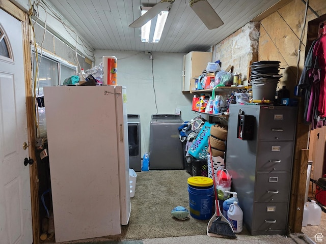 storage room featuring washer and clothes dryer and ceiling fan