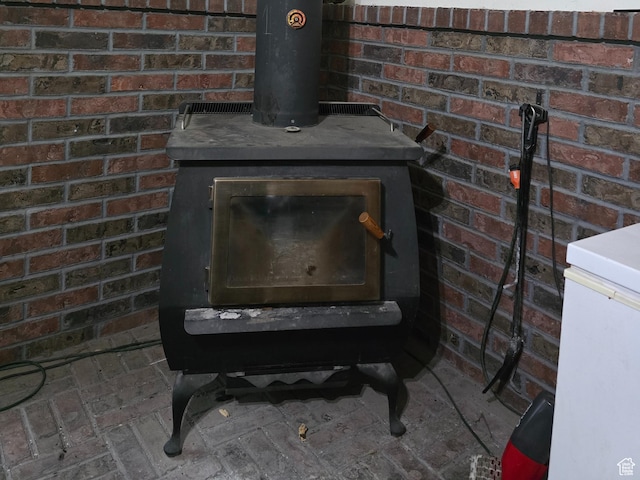 detailed view of a wood stove and brick wall