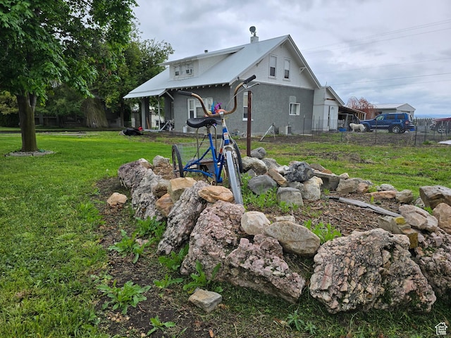 rear view of house with stucco siding