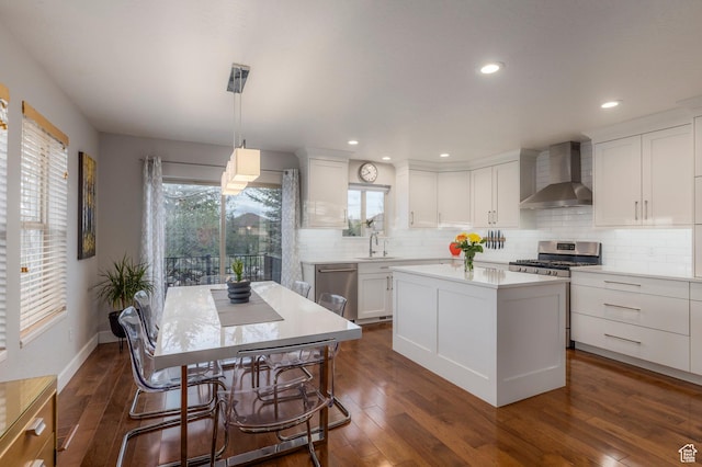 1267 E Foxcrest Ct, Park City, UT 84098 - kitchen featuring wall chimney range hood, stainless steel appliances, white cabinets, decorative backsplash, and recessed lighting