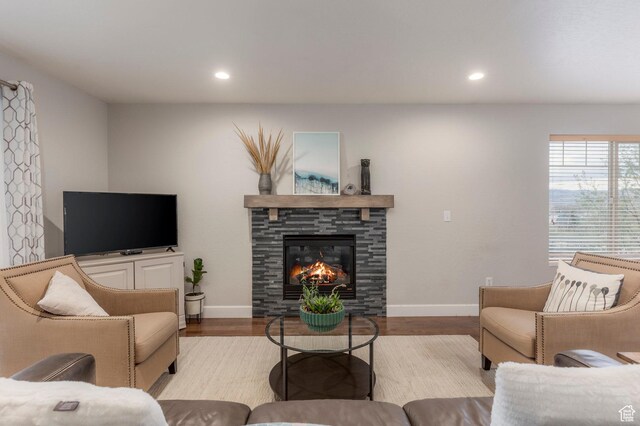 1267 E Foxcrest Ct, Park City, UT 84098 - living room with baseboards, recessed lighting, wood finished floors, and a stone fireplace