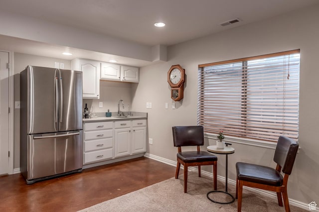 1267 E Foxcrest Ct, Park City, UT 84098 - kitchen with freestanding refrigerator, a sink, baseboards, white cabinetry, and recessed lighting