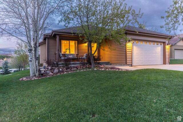 1267 E Foxcrest Ct, Park City, UT 84098 - view of front of property featuring a front yard, driveway, an attached garage, and covered porch