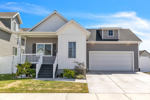 view of front facade featuring board and batten siding, covered porch, an attached garage, and concrete driveway
