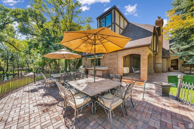 305 S Rachel Ln, New Harmony, UT 84757 - view of patio featuring outdoor dining area, fence, and grilling area