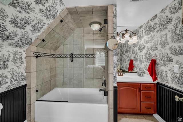 305 S Rachel Ln, New Harmony, UT 84757 - bathroom featuring wallpapered walls, wainscoting, bath / shower combo with glass door, and vanity