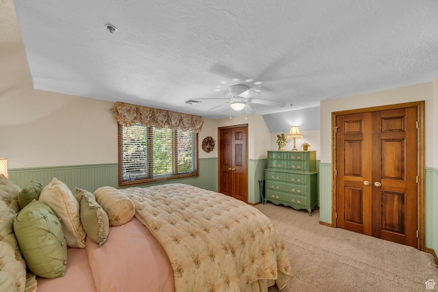 305 S Rachel Ln, New Harmony, UT 84757 - carpeted bedroom with a wainscoted wall, a textured ceiling, and ceiling fan