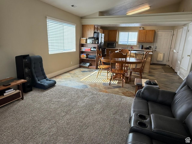 246 W Inauguration Rd S, Draper, UT 84020 - living area featuring baseboards, lofted ceiling, and light stone finish floors