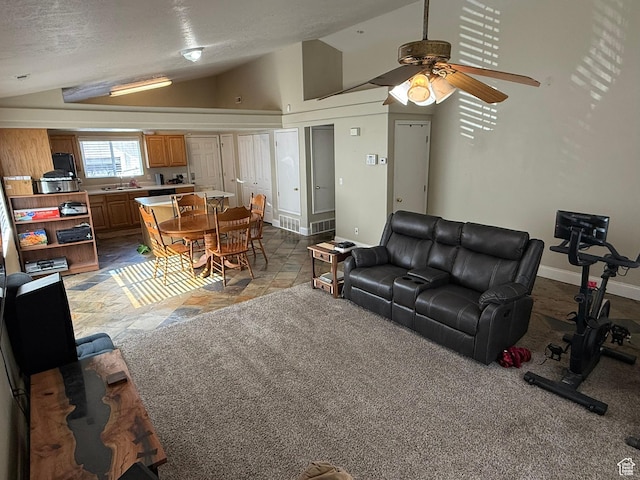 246 W Inauguration Rd S, Draper, UT 84020 - living area featuring vaulted ceiling, a ceiling fan, baseboards, and light stone finish floors