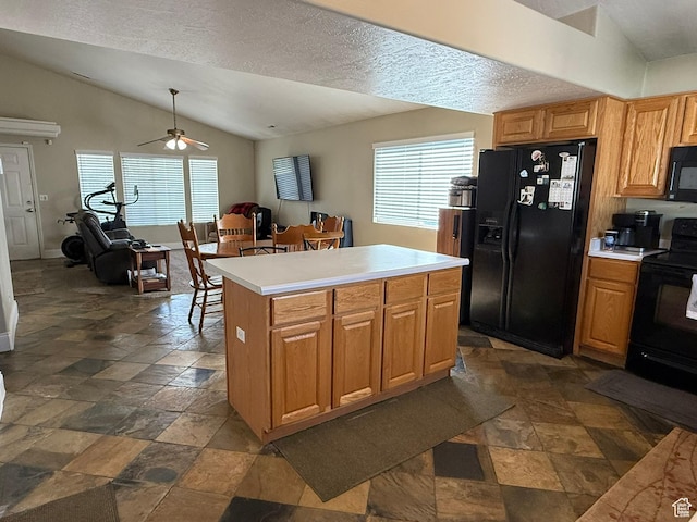 246 W Inauguration Rd S, Draper, UT 84020 - kitchen featuring black appliances, vaulted ceiling, plenty of natural light, dark stone finish flooring, and a ceiling fan