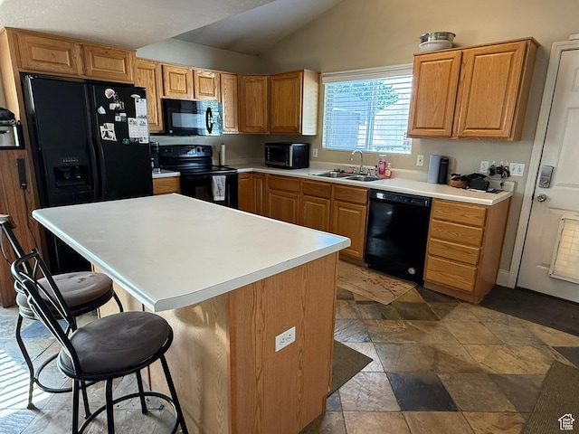 246 W Inauguration Rd S, Draper, UT 84020 - kitchen with black appliances, a sink, a breakfast bar area, vaulted ceiling, and light countertops