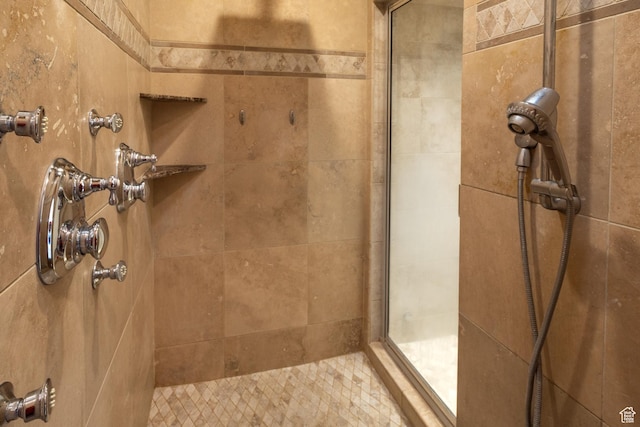 full bathroom with a tile shower