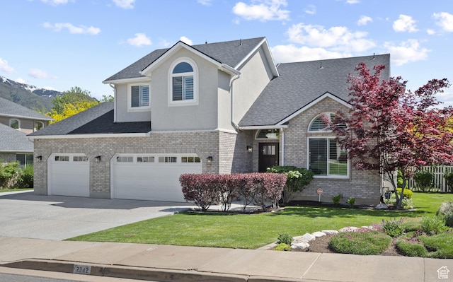 2242 E Deere View Dr N, Layton, UT 84040 - view of front of property featuring concrete driveway, a front yard, roof with shingles, and brick siding
