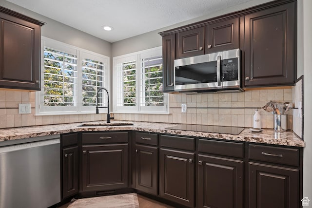 2242 E Deere View Dr N, Layton, UT 84040 - kitchen with stainless steel appliances, a sink, healthy amount of natural light, and light stone countertops
