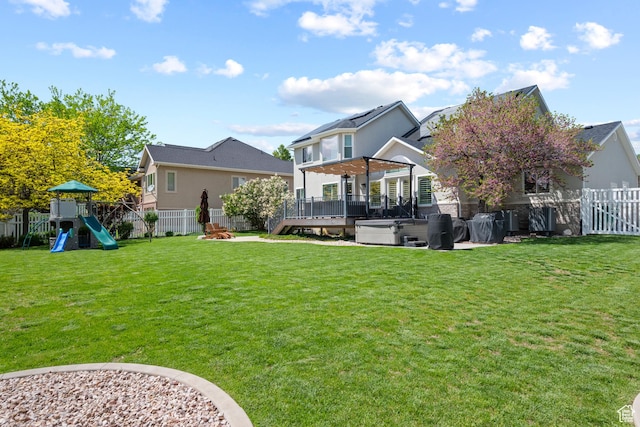2242 E Deere View Dr N, Layton, UT 84040 - rear view of property featuring a hot tub, a playground, and a deck