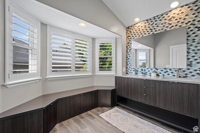 2242 E Deere View Dr N, Layton, UT 84040 - full bath with wood finished floors, double vanity, recessed lighting, decorative backsplash, and vaulted ceiling