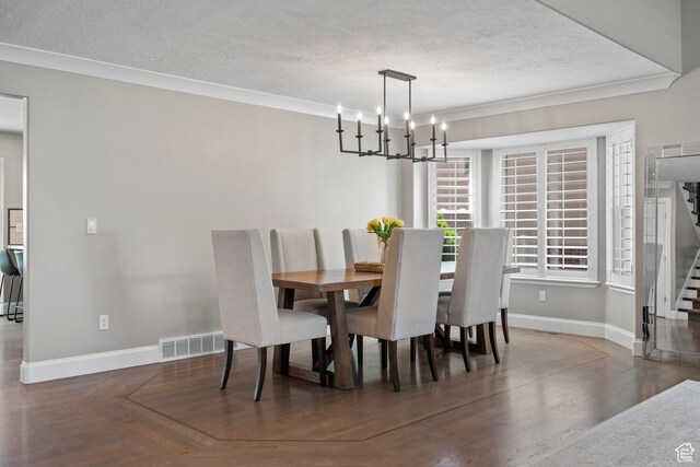 2242 E Deere View Dr N, Layton, UT 84040 - dining area featuring a textured ceiling, stairs, baseboards, a chandelier, and crown molding