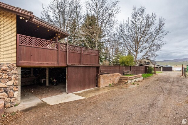 125 E Countryside Cir, Park City, UT 84098 - view of yard with driveway, a wooden deck, and a garage