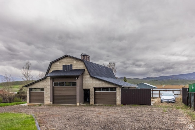 125 E Countryside Cir, Park City, UT 84098 - detached garage featuring fence, dirt driveway, and a mountain view