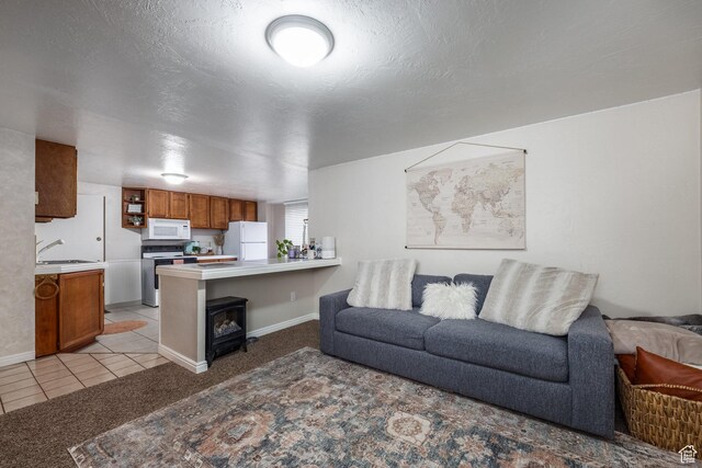 125 E Countryside Cir, Park City, UT 84098 - living room featuring light carpet, light tile patterned flooring, baseboards, and a wood stove