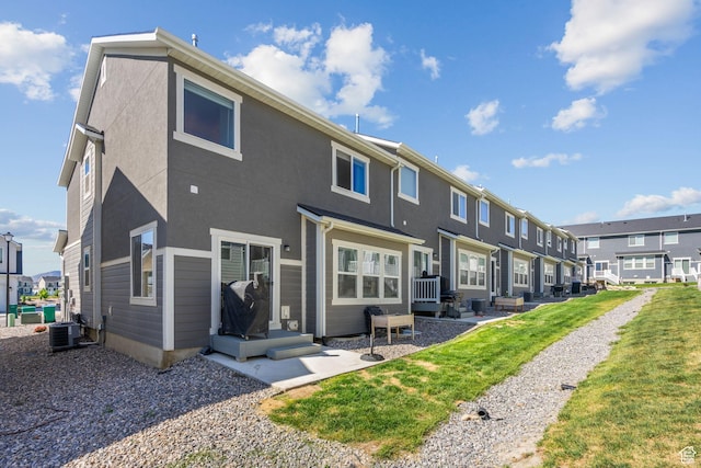 rear view of house with a residential view and cooling unit