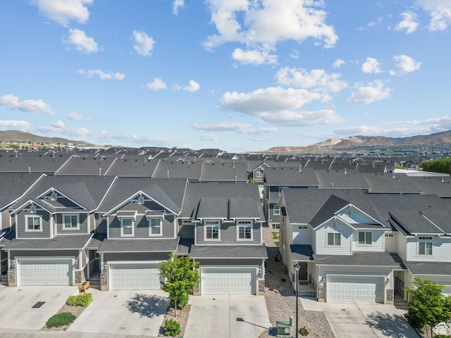 aerial perspective of suburban area with a mountainous background