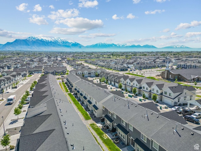 aerial perspective of suburban area with a mountainous background