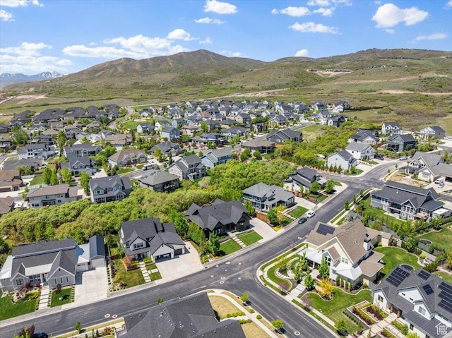 aerial overview of property's location with nearby suburban area and mountains