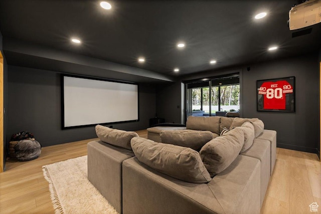 home theater featuring light wood-type flooring and recessed lighting
