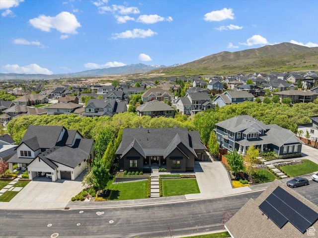 aerial view of residential area featuring a mountain backdrop