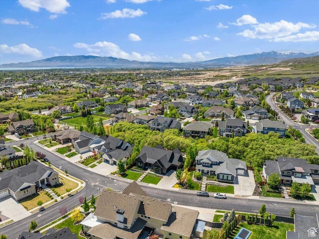aerial view of residential area featuring a mountainous background
