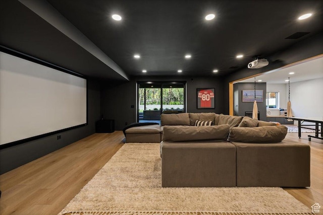 home theater room featuring light wood finished floors and recessed lighting