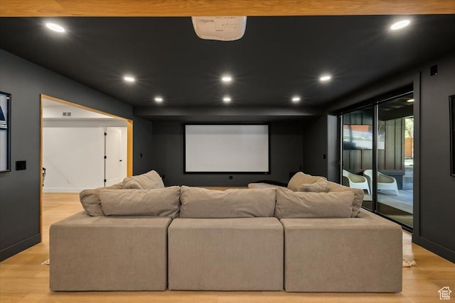 home theater room with recessed lighting, light wood-style floors, and baseboards