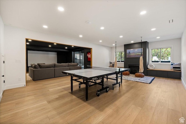 game room featuring light wood-style flooring, baseboards, and recessed lighting