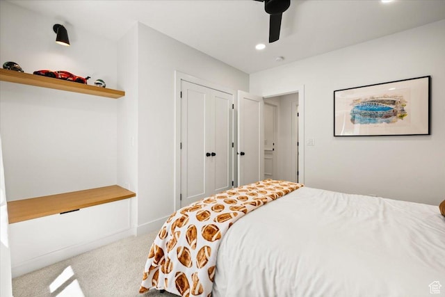 bedroom featuring carpet, recessed lighting, a ceiling fan, and a closet