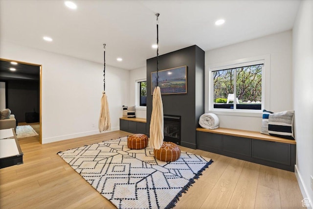 office space with light wood-style flooring, recessed lighting, and baseboards