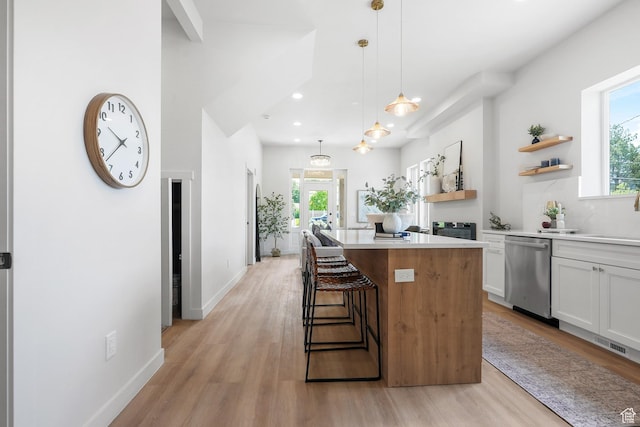 3670 S 1300 E, Millcreek, UT 84106 - kitchen with stainless steel dishwasher, open shelves, light wood-style floors, a kitchen island, and recessed lighting