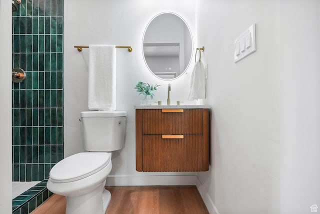3670 S 1300 E, Millcreek, UT 84106 - full bathroom featuring toilet, vanity, walk in shower, wood finished floors, and baseboards