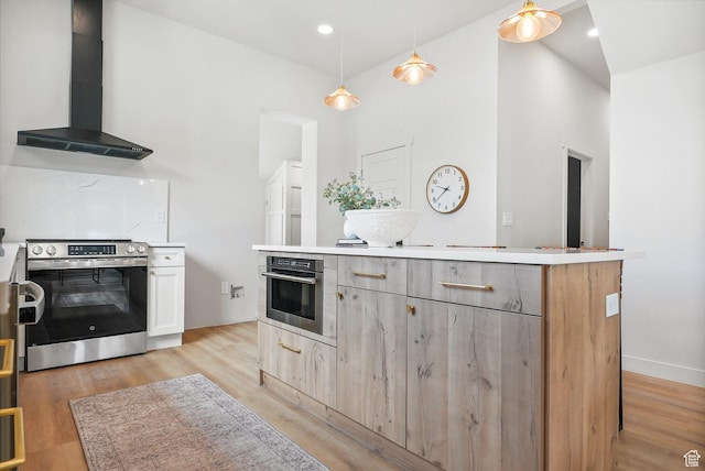 3670 S 1300 E, Millcreek, UT 84106 - kitchen featuring stainless steel appliances, wall chimney exhaust hood, light wood finished floors, hanging light fixtures, and a high ceiling
