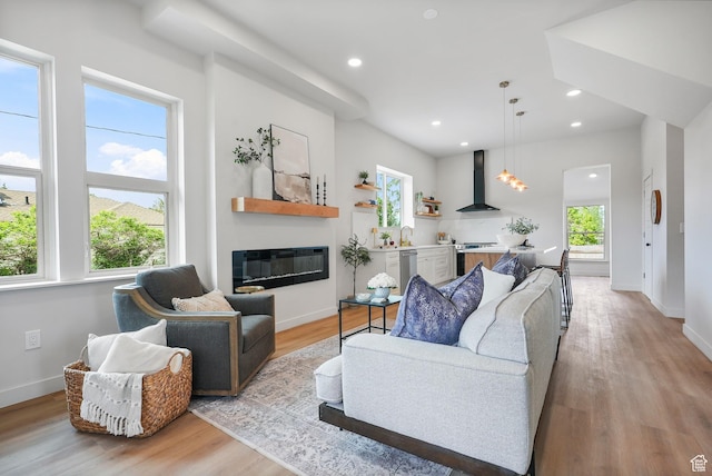 3670 S 1300 E, Millcreek, UT 84106 - living room featuring a glass covered fireplace, light wood-style flooring, baseboards, and recessed lighting