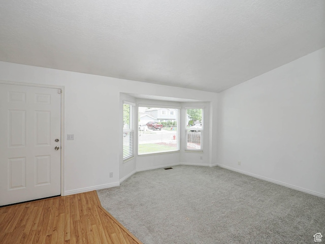 entrance foyer with baseboards and light wood-style flooring