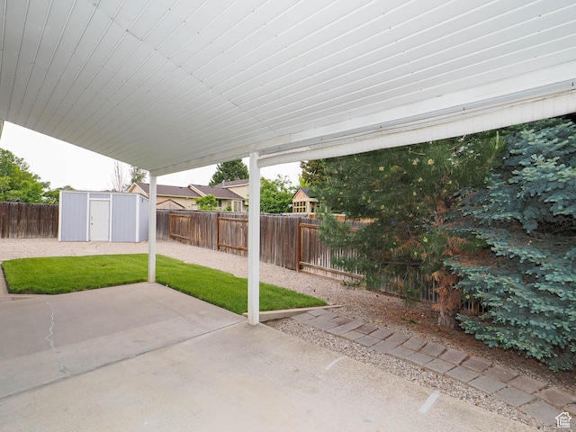 view of patio / terrace with a shed and an outdoor structure