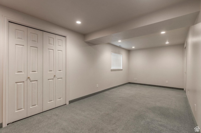 unfurnished bedroom with carpet, recessed lighting, baseboards, and a closet