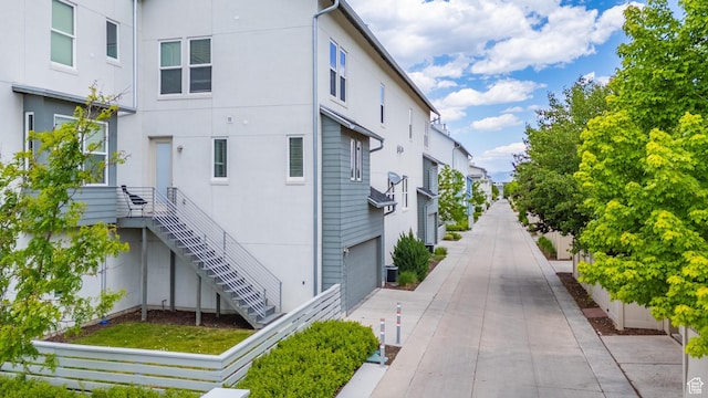 5059 W Daybreak Pkwy, South Jordan, UT 84009 - view of property exterior with stucco siding and stairway
