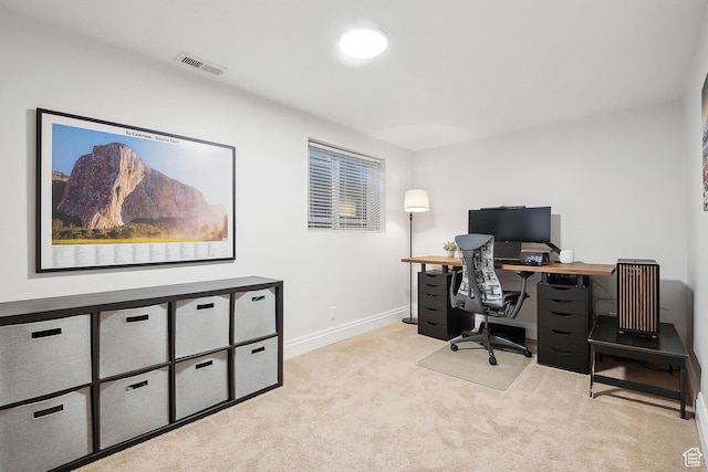 carpeted office featuring baseboards