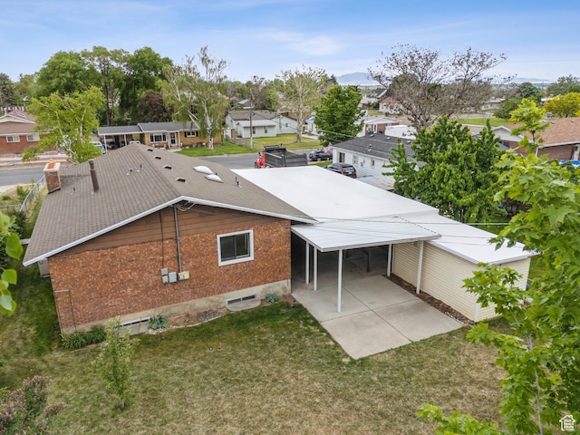 2268 W 5300 S, Roy, UT 84067 - back of property featuring brick siding, a residential view, and a yard