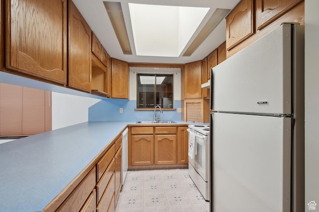 2268 W 5300 S, Roy, UT 84067 - kitchen with white appliances, a sink, light flooring, light countertops, and brown cabinetry