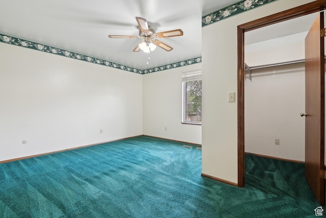2268 W 5300 S, Roy, UT 84067 - unfurnished bedroom with carpet, a walk in closet, baseboards, a closet, and ceiling fan