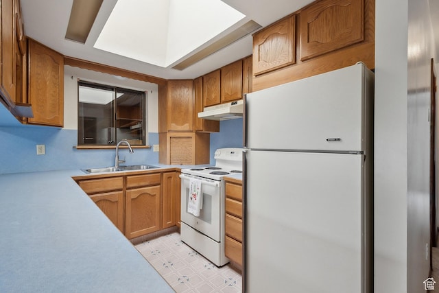 2268 W 5300 S, Roy, UT 84067 - kitchen featuring white appliances, a sink, under cabinet range hood, light countertops, and light flooring